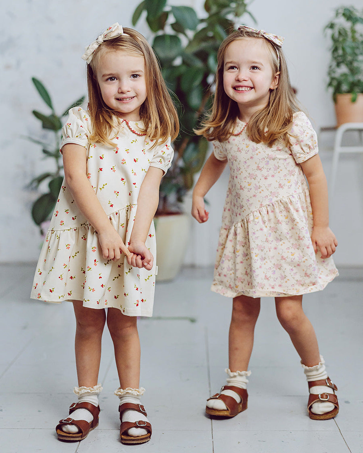 Two children in Happyology dresses